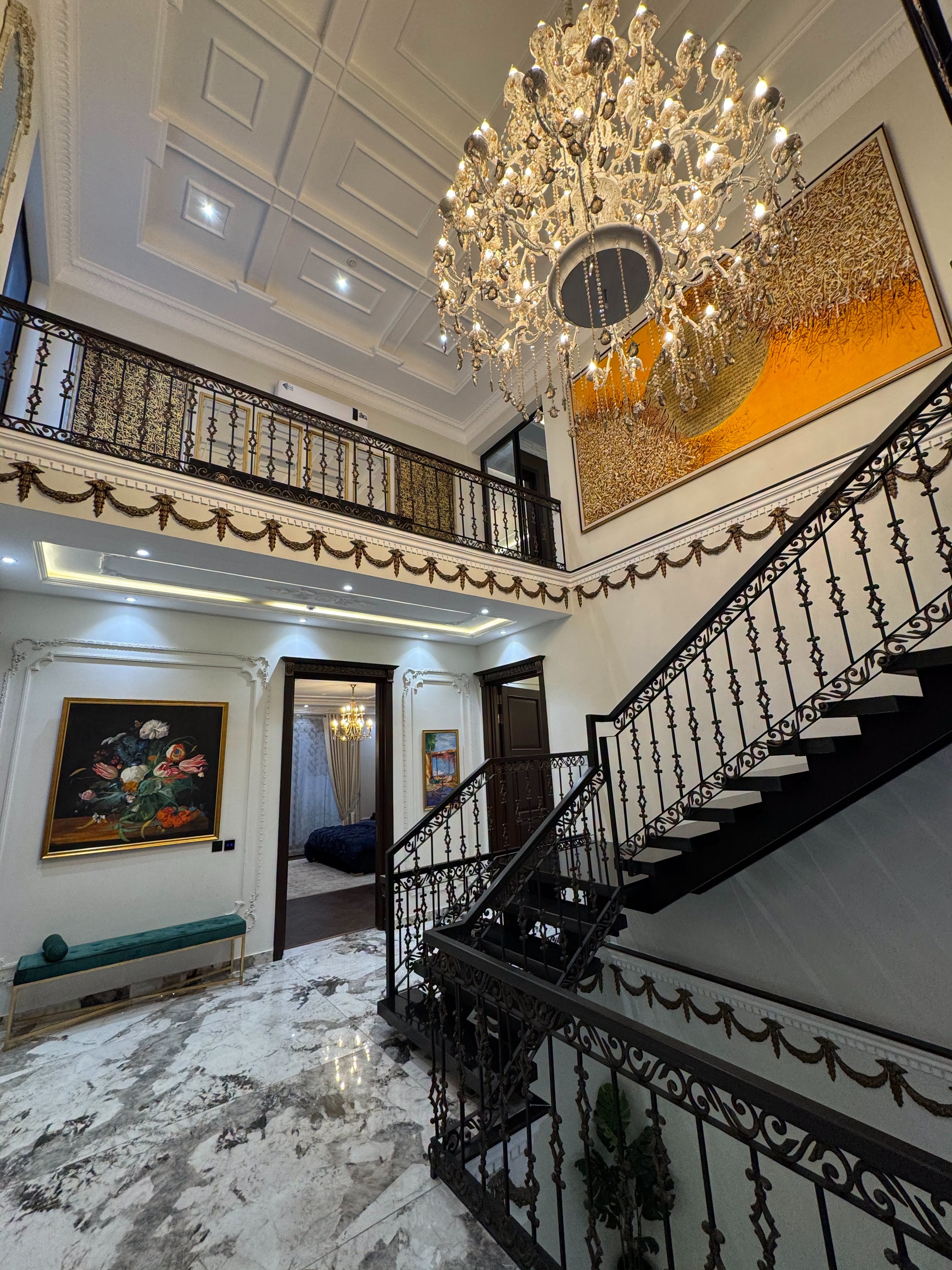 24 Marla Classical House DHA Phase 6 Block F - grand staircase with chandelier